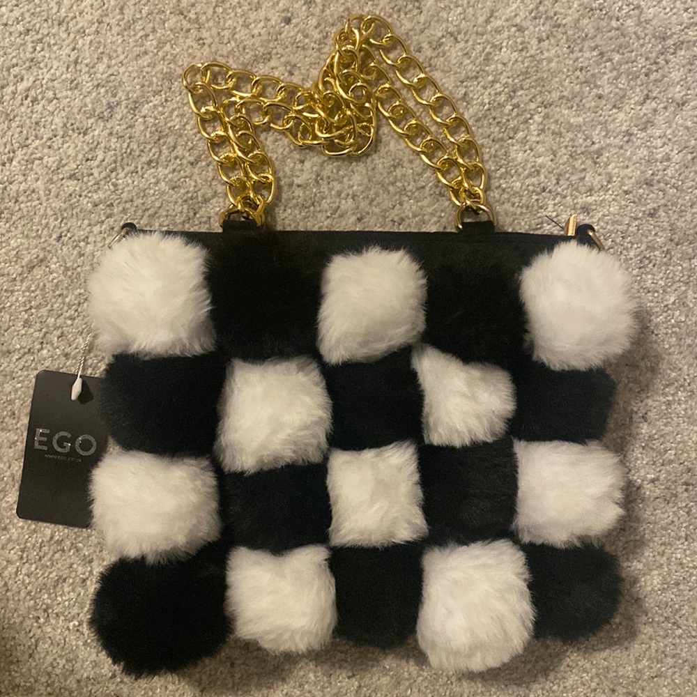 Black and white checkered pompom purse